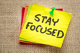 stay focused reminder on a sticky note