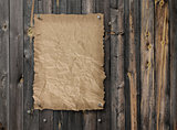 Empty wanted poster on weathered plank wood wall