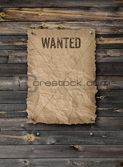 Wanted poster on weathered plank wood wall