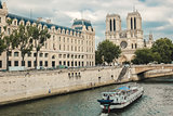 Notre Dame  with boat on Seine, France