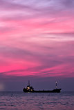 Cargo ship in South China Sea at dusk, Vietnam