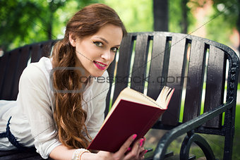 Woman Reading book in the Park