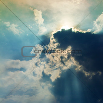 Clouds in sky with rays of light 