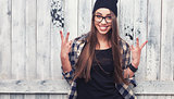 Hipster girl in glasses and black beanie