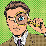 The man is a detective looking through magnifying glass search p