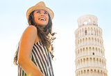 Happy woman tourist at Leaning Tower of Pisa