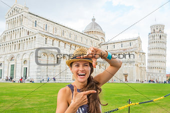 Laughing woman tourist making finger photo frame in Pisa