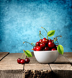 Red cherries in plate