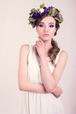 Girl with flower crown posing in studio