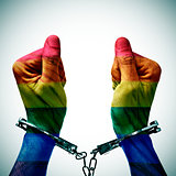 handcuffed hands denouncing the criminalization of homosexuality