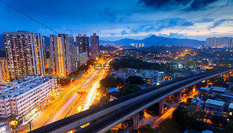 hong kong urban downtown and high speed train at night