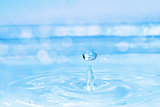 blue water drop, splash with bokeh
