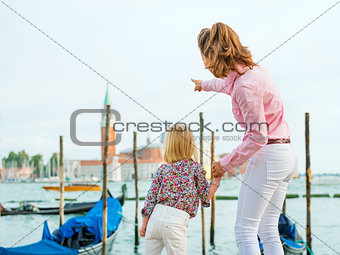 Mother pointing out San Giorgio Maggiore church to daughter