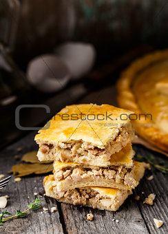 Homemade pie stuffed with chicken ang eggs