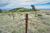 Abandoned military zone with rusty spiked fence