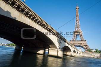 The Eiffel Tower and bridge over Seine River in Paris