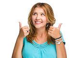 Young woman is showing thumb up gesture 