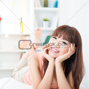 Happy Asian girl at home