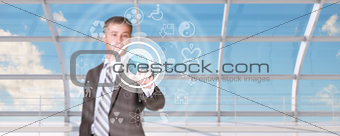 Businessman pressing on holographic screen