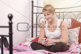 Young teenage girl texting on her mobile