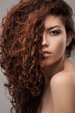woman with healthy brown curly hair