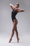 young beautiful dancer in black swimsuit