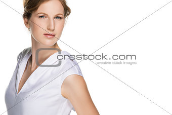 Fashion portrait of a girl in the beautiful designer white dress