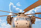 Military helicopter rotor with blue sky background