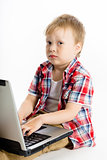 child with a laptop. studio