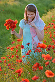 girl  in field of poppies 