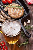 Beer mug and grilled sausages