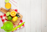 Citrus fruits and glass of juice. Oranges, limes and lemons