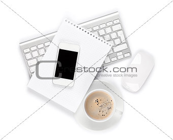 Office desk with computer, supplies and coffee cup