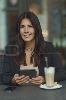 Smiling woman in coffee shop