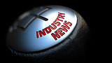 Industry News on Gear Stick with Red Text.