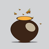 Bees fly to the pitcher with honey