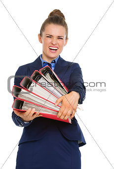 Business woman struggling to carry big files
