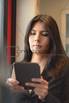 Brunette woman using tablet