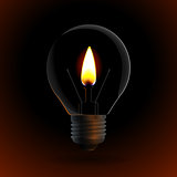 lightbulb with fire candle on dark background