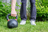 kettlebell workout in backyard