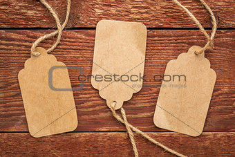 blank paper price tags on rustic wood