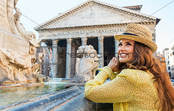 Happy woman tourist at the Pantheon fountain in Rome