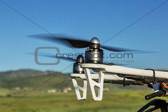 blurred propellers of airborne drone