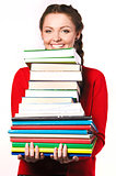 girl standing with a bunch of books
