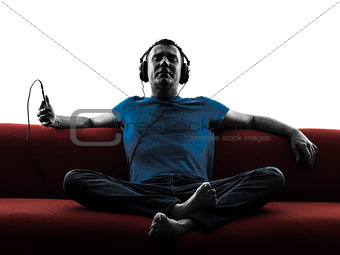 man sofa coach listening music audio