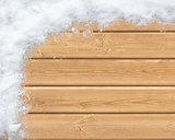 Snow-covered wooden surface