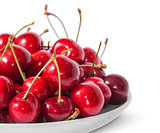 Closeup red sweet cherries in white plate