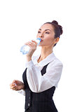 Confident businesswoman having drink from water bottle. All isolated on white background.
