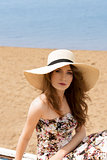 girl in summer dress on the beach 