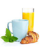 Cup of coffee, orange juice and fresh croissant